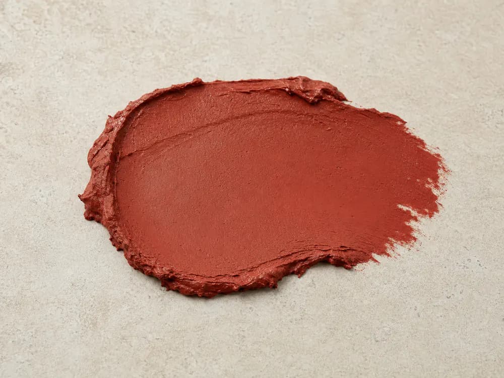 Realistic Red Oxide Metal Primer sample on a neutral mineral surface