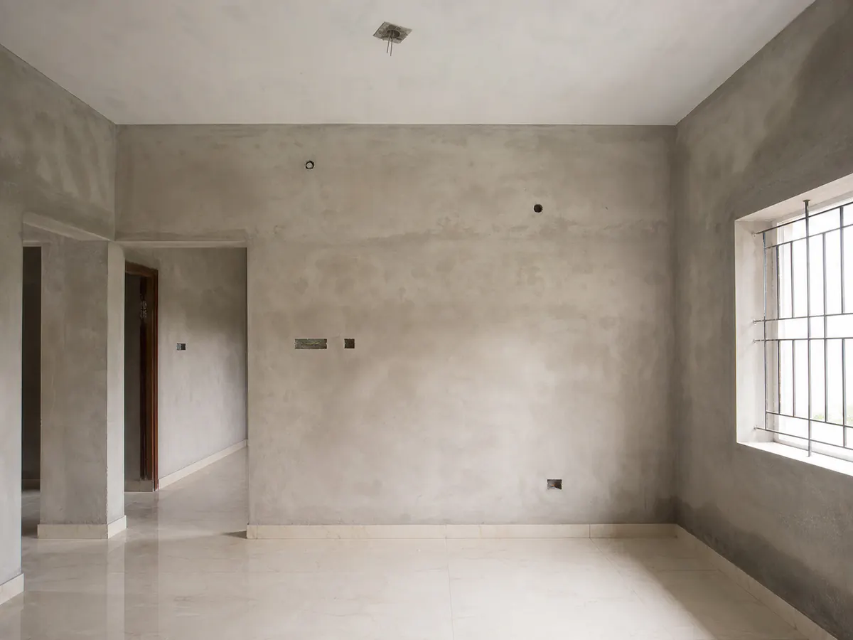 Illustrative newly plastered home interior before its first paint system