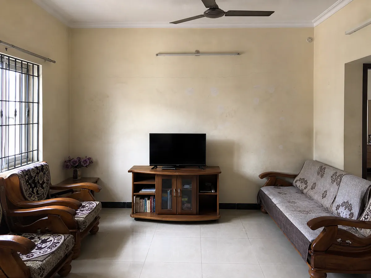 Illustrative furnished room with faded and uneven walls before repainting